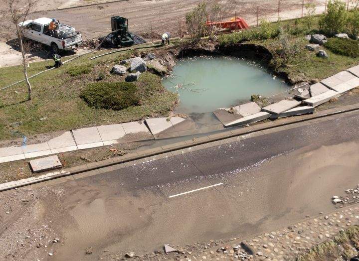 A view of the aftermath of a water main break in northwest Calgary's Montgomery neighbourhood on June 6, 2024.The water main break happened the night before.