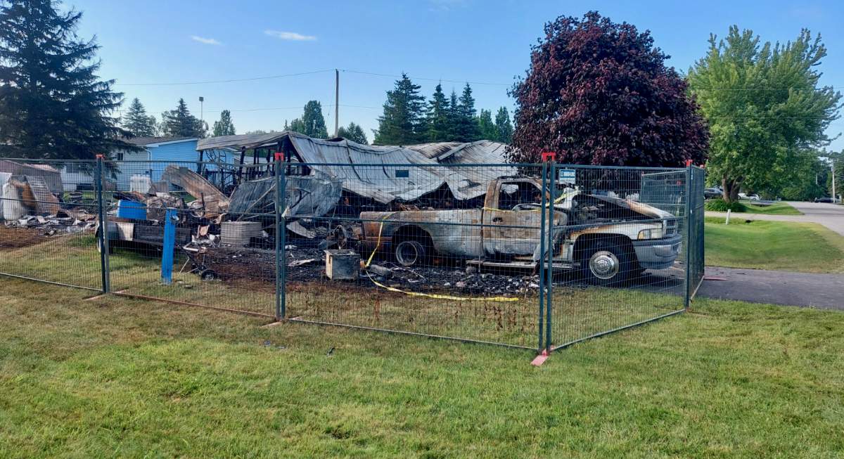 The fire destroyed a pickup truck and a home.