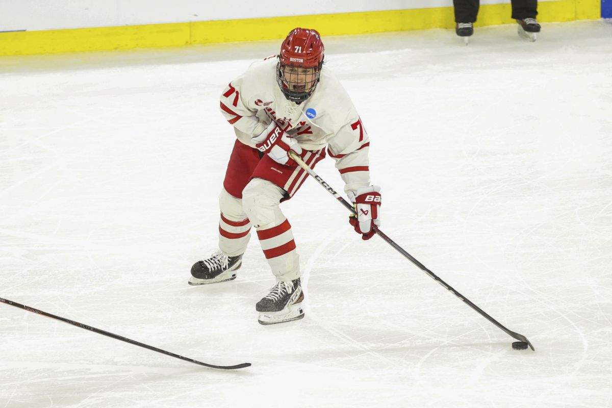 Boston University's Macklin Celebrini (71) looks to pass the puck against Rochester during an NCAA men's college hockey tournament regional game Thursday, March 28, 2024, in Sioux Falls, S.D.