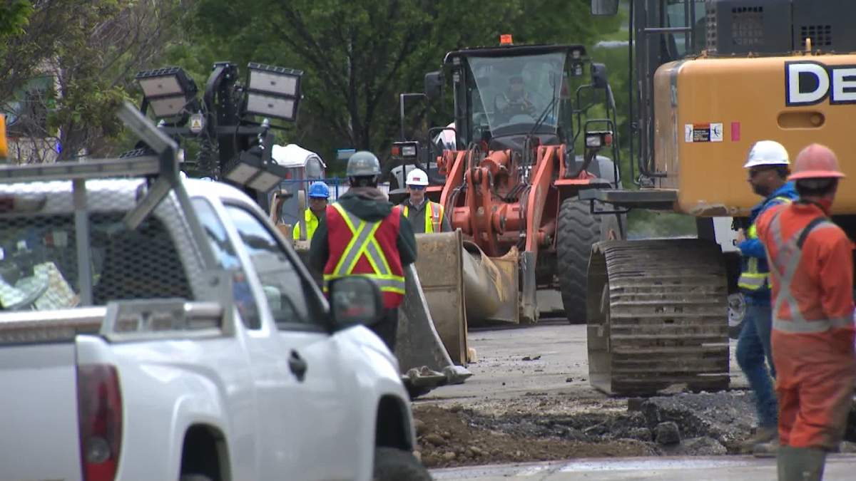 Crews work on water main repairs in northwest Calgary on June 17, 2024.