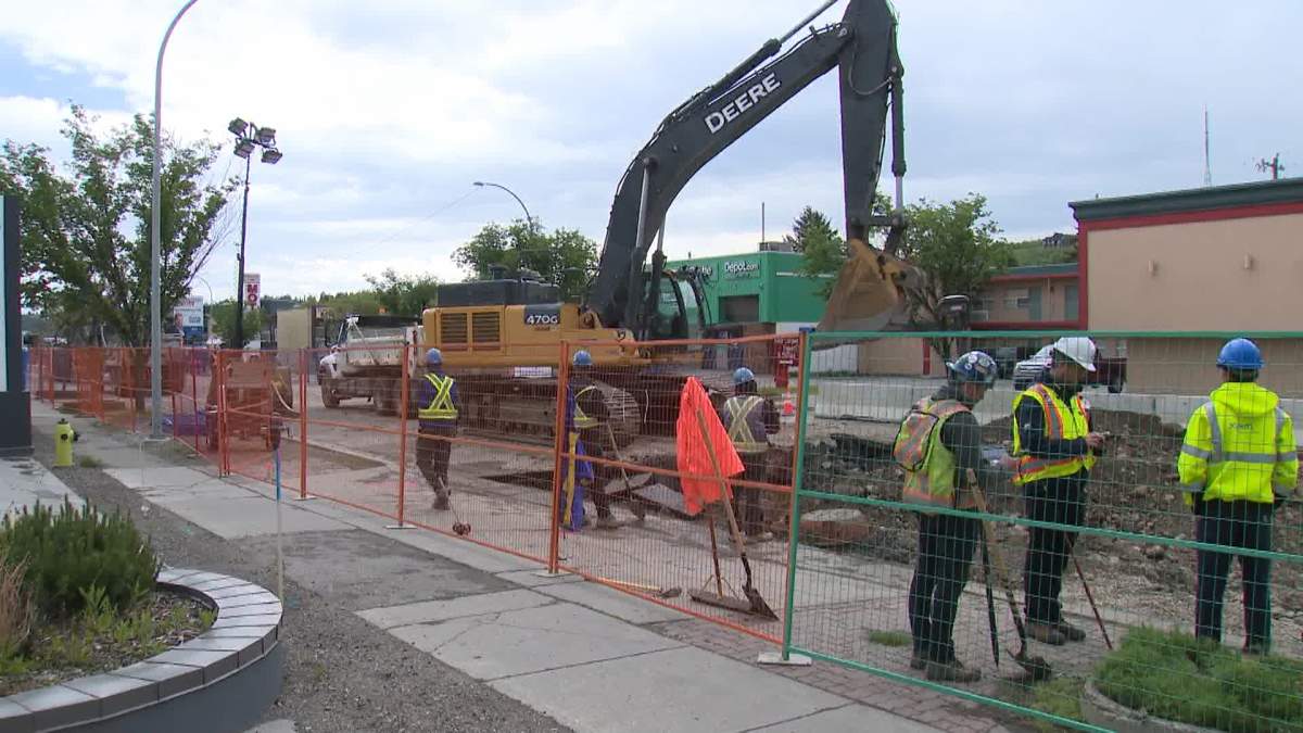 Crews work on water main repairs in northwest Calgary on June 17, 2024.