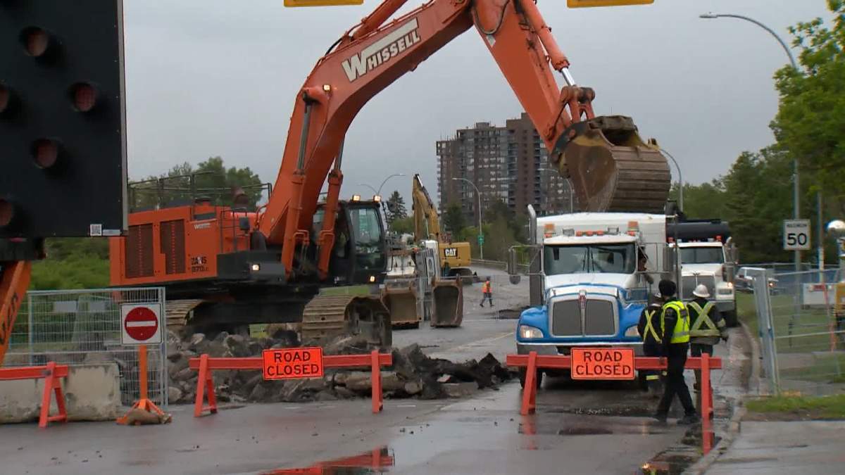Crews work on water main repairs in northwest Calgary on June 17, 2024.