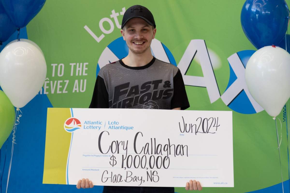 Cory Callaghan of Glace Bay, N.S. holds his $1 million lotto win.