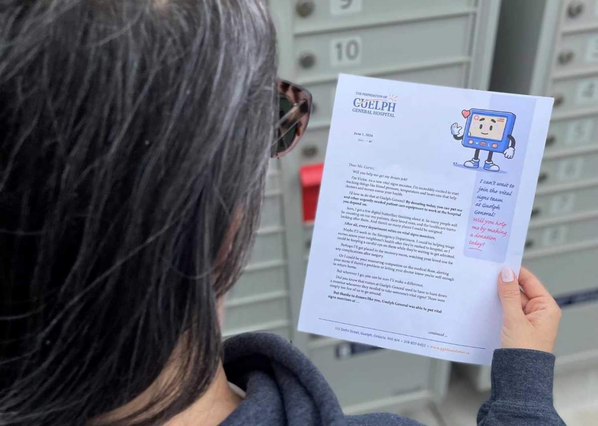 A resident reads a letter from the Foundation of Guelph General Hospital.