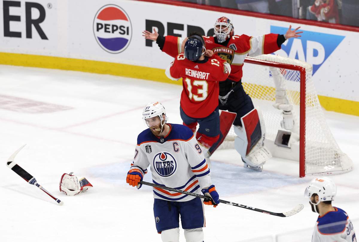 Florida Panthers’ Sergei Bobrovsky and Sam Reinhart of the celebrate while Edmonton Oilers captain Connor McDavid skates away after Florida’s 2-1 victory in Game Seven of the 2024 Stanley Cup Final on June 24, 2024.