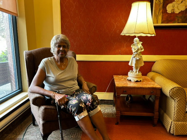 Wilma Smith, a Wellesley seniors home resident, sits in the lobby on Tuesday, June 18. A planned Hydro-Québec outage affecting some 1,600 people, including a seniors residence, is going ahead despite pleas to delay amidst extreme heat.