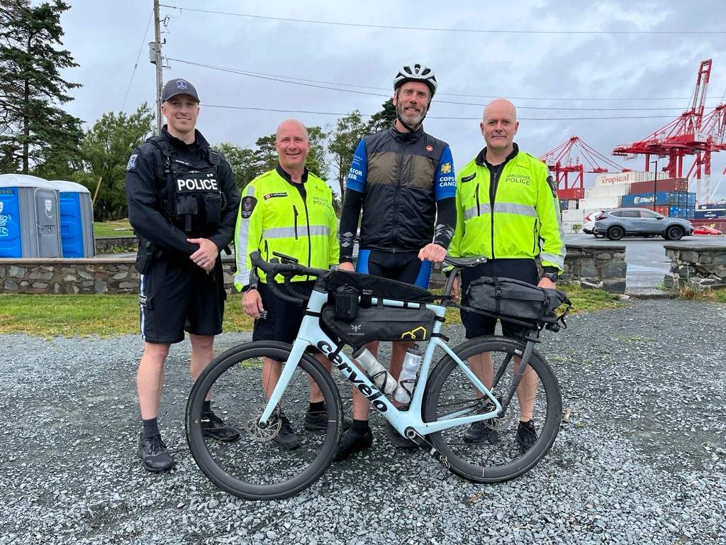 Sgt. Dayne Campbell of the Vancouver Police Department stands with supporters after completing his cross-country tour with Cops for Cancer in Halifax on Thursday, June 27.