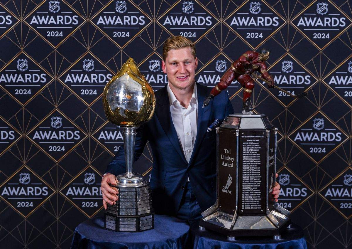 Colorado Avalanche forward Nathan MacKinnon stands with his trophies as the recipient of the Hart Memorial Trophy, left, and Ted Lindsay Award at hockey's NHL Awards, Thursday, June 27, 2024, in Las Vegas.