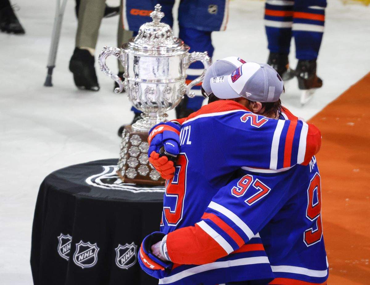 Edmonton Oilers forward Connor McDavid (97) and forward Leon Draisaitl (29) embrace after defeating the Dallas Stars in Game 6 of the Western Conference finals of the NHL hockey Stanley Cup playoffs in Edmonton, Sunday, June 2, 2024.