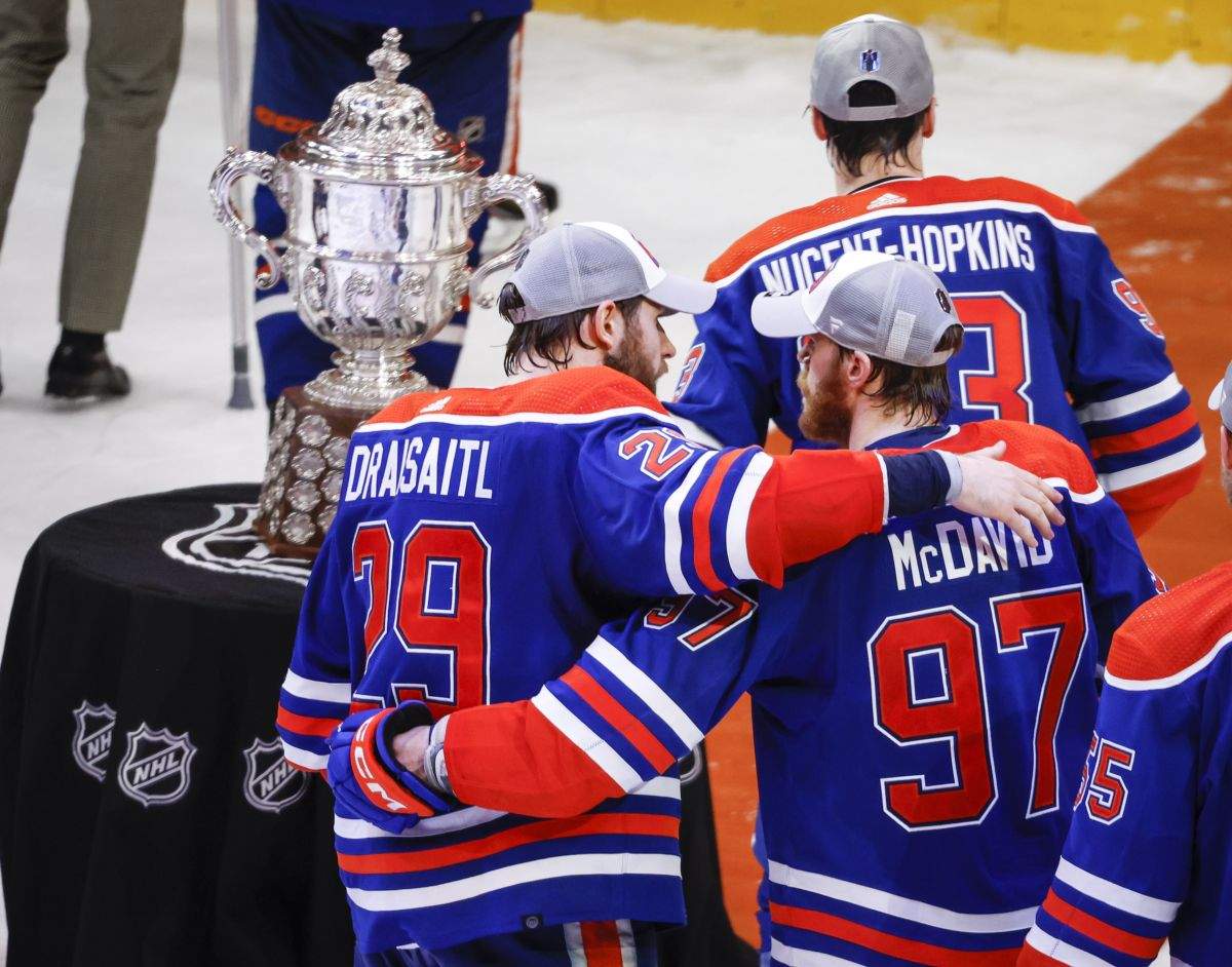 Edmonton Oilers forward Connor McDavid (97) and forward Leon Draisaitl (29) embrace after defeating the Dallas Stars in Game 6 of the Western Conference finals of the NHL hockey Stanley Cup playoffs in Edmonton, Sunday, June 2, 2024.