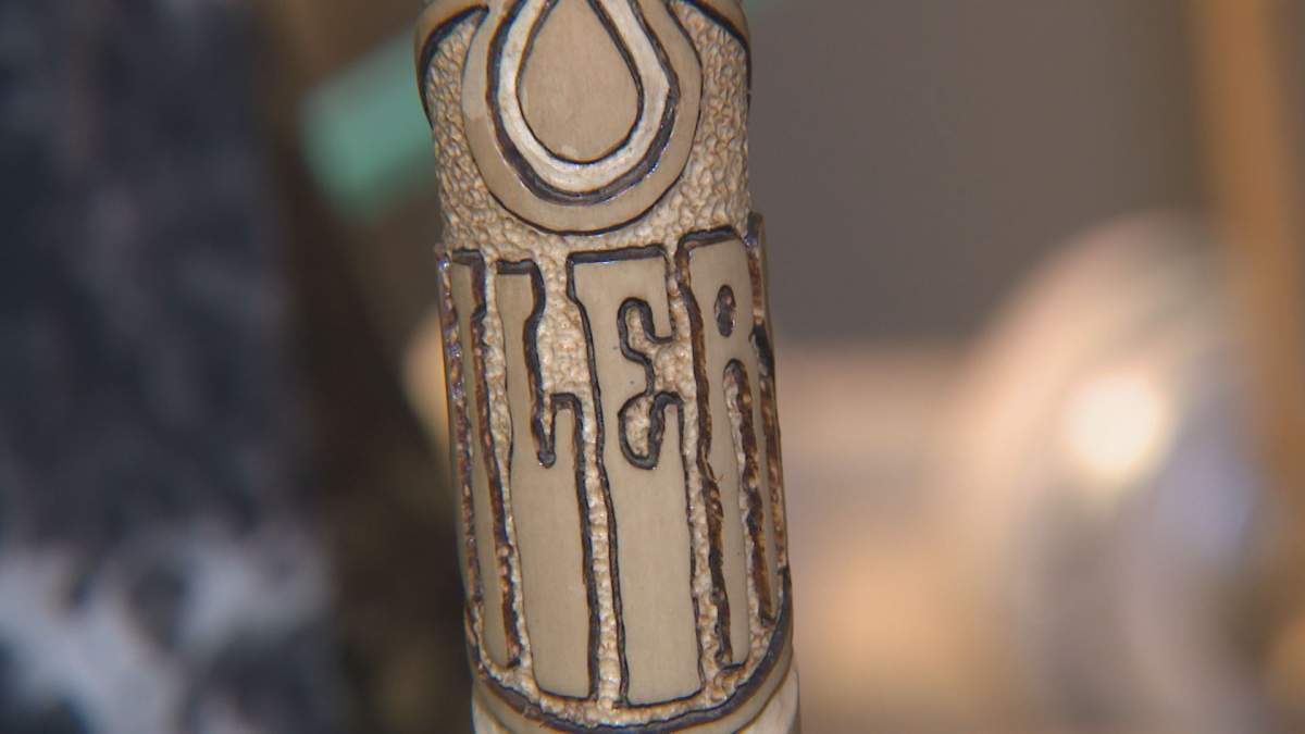 Brian Boser's relief carving walking stick for Edmonton Oilers.