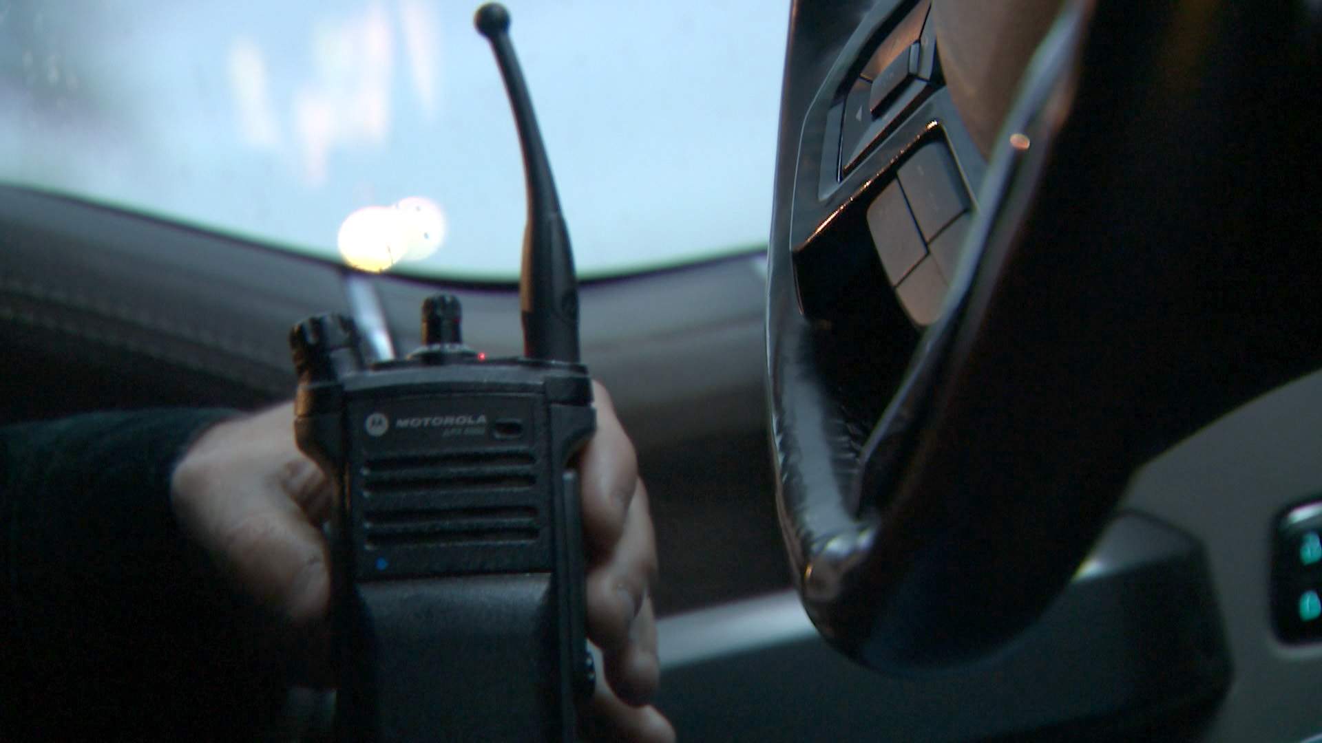 Det. Scott Cresswell listens on his police radio as his team follows the suspected car thieves.