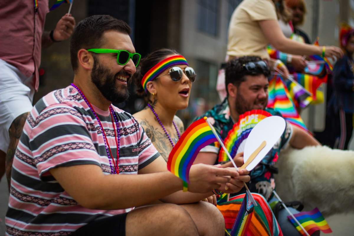 Members of the community cheer on the parade.