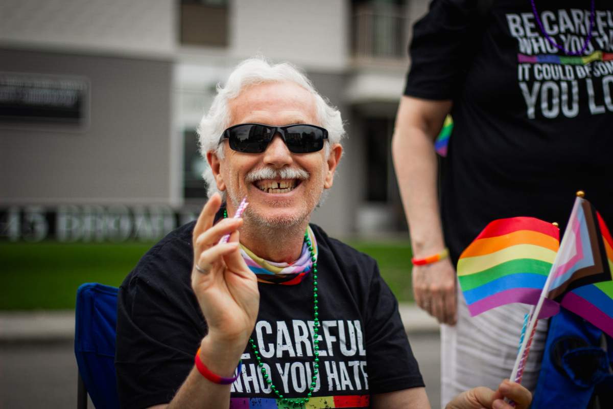 One Regina resident looks on at the 2024 Queen City Pride Parade.