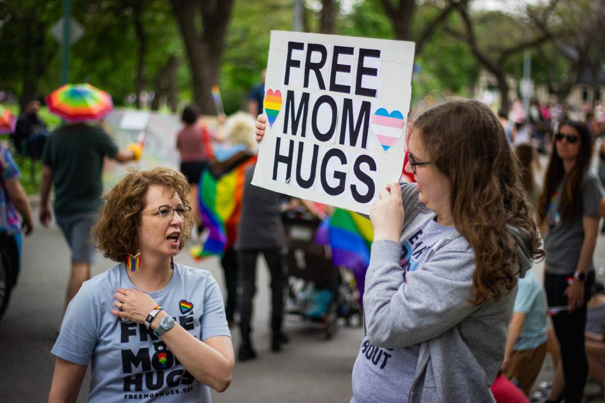 People throughout the parade stopped for a “free mom hug.”