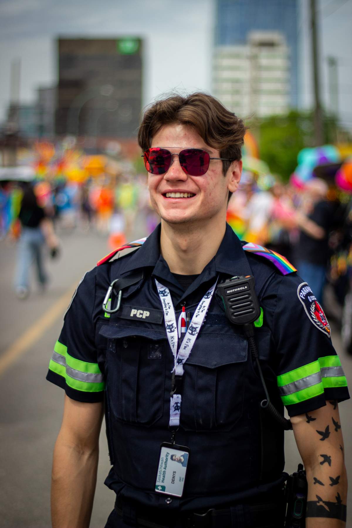 One Regina paramedic gets ready for the Queen City Pride Parade.