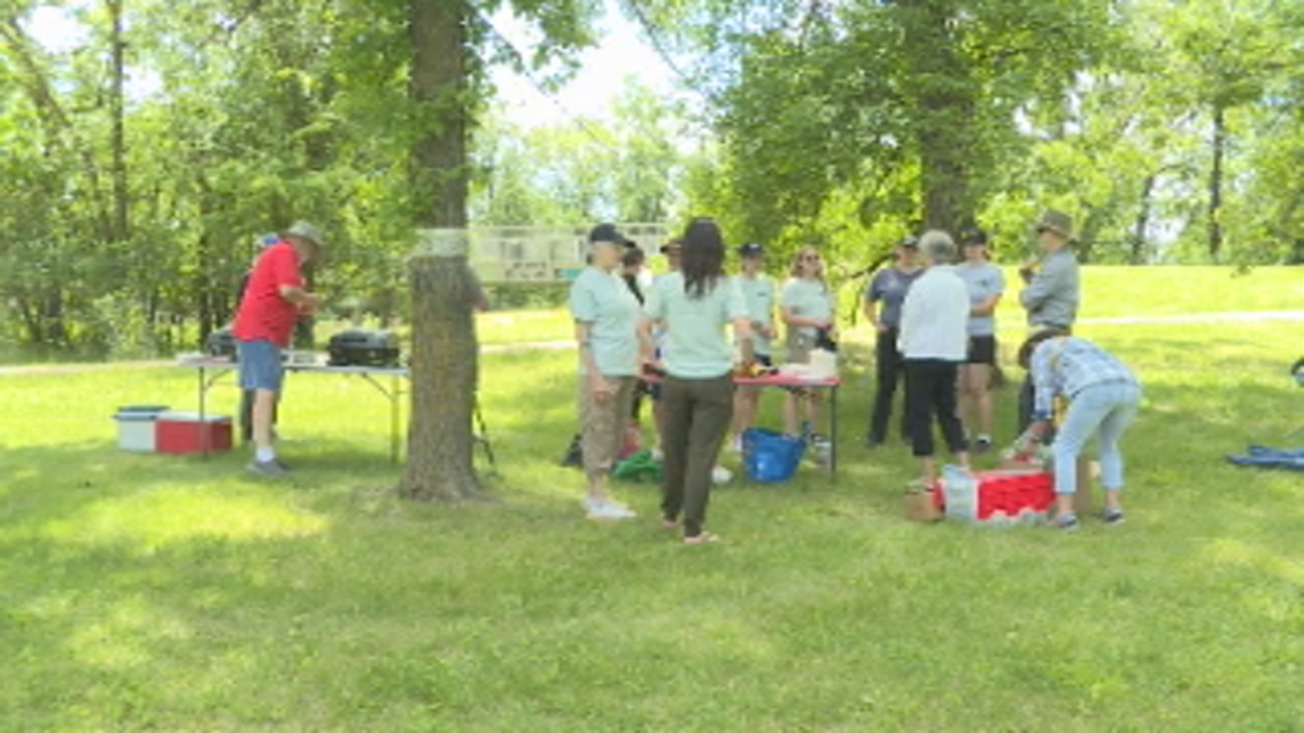 Members of Save Our Seine talk amongst themselves.