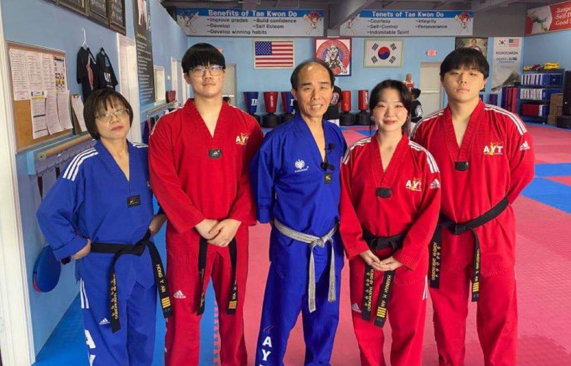The An family poses for a photo inside their dojo.