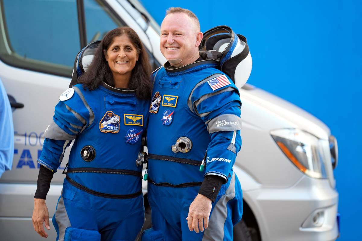 NASA astronauts Suni Williams, left, and Butch Wilmore pose for a photo after leaving the operations and checkout building for a trip to launch pad at Space Launch Complex 41 Wednesday, June 5, 2024, in Cape Canaveral, Fla.