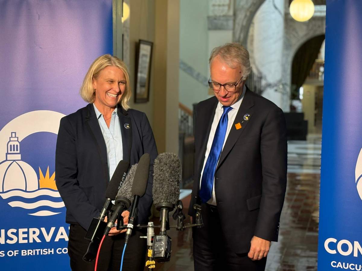 Elenore Sturko speaks with BC Conservative Leader John Rustad after crossing the floor to join his party on Monday, June 3, 2024.