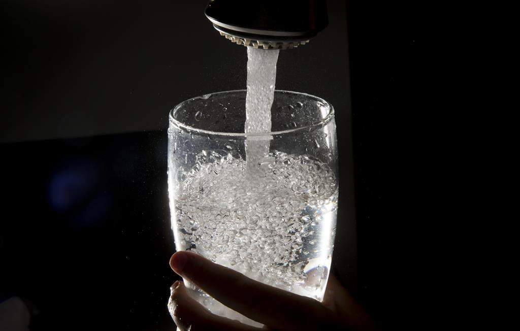 Halifax Water says a boil-water advisory is in effect for the Halifax area and some surrounding communities after a power interruption at a water treatment facility. Drinking water is poured into a glass from a faucet in Vancouver on Tuesday, July, 30, 2019. THE CANADIAN PRESS/Jonathan Hayward.