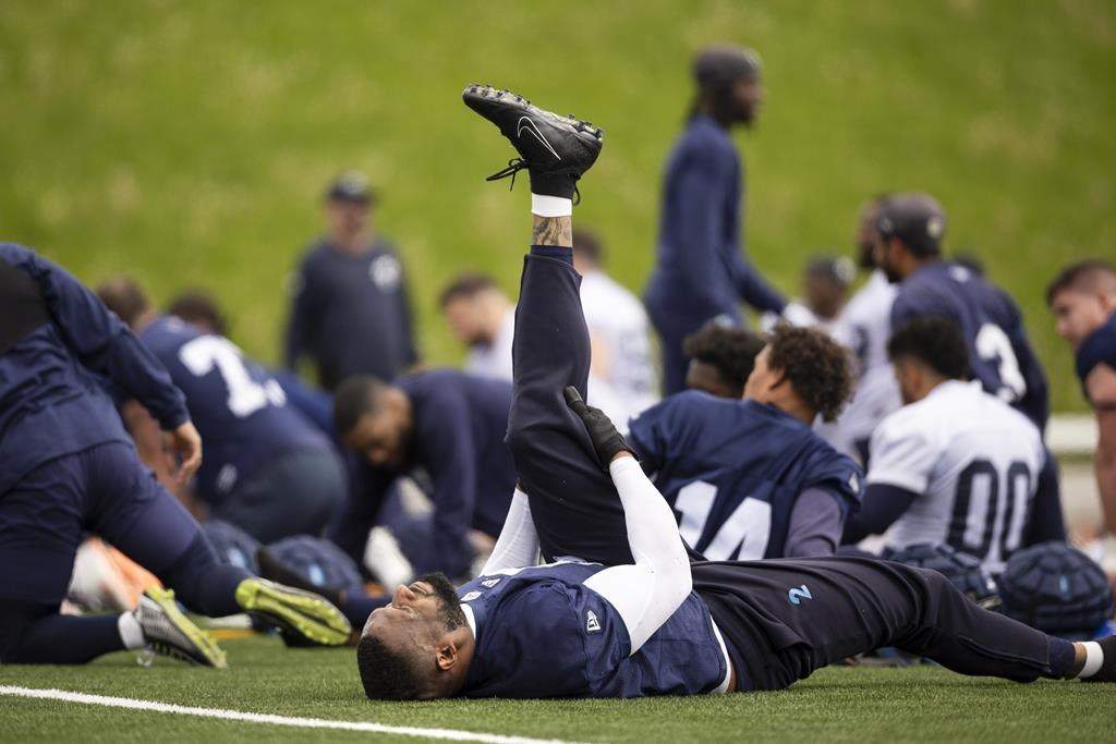Shawn Oakman stretches during CFL training camp at Alumni Stadium in Guelph, Ont., Sunday, May 12, 2024.