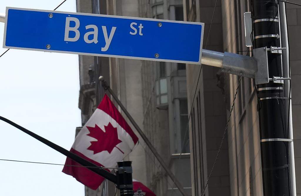 The Bay Street Financial District is shown with the Canadian flag in Toronto on Friday, August 5, 2022. 