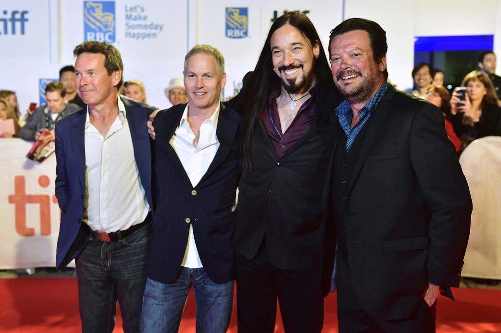 Members of The Tragically Hip, from left, Gord Sinclair, Johnny Fay, Rob Baker and Paul Langlois arrive on the red carpet for the movie "Long Time Running" during the 2017 Toronto International Film Festival in Toronto on September 13, 2017. 