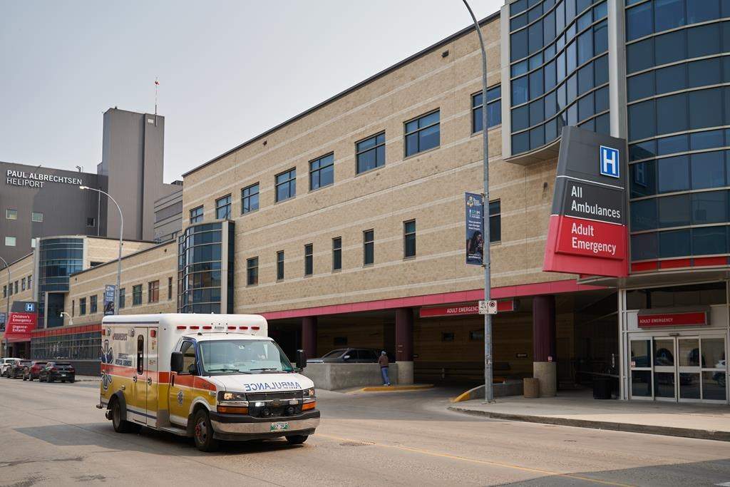 An ambulance drives past Health Sciences Centre in Winnipeg on Thursday, June 15, 2023. 
