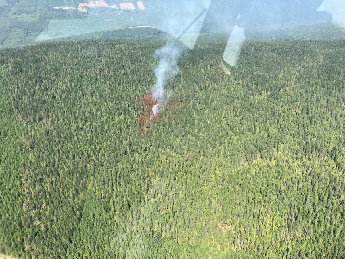 Smoke rises from the Blueberry Creek wildfire, which is located in the hills above Dasnier’s Bay along Shuswap Lake.