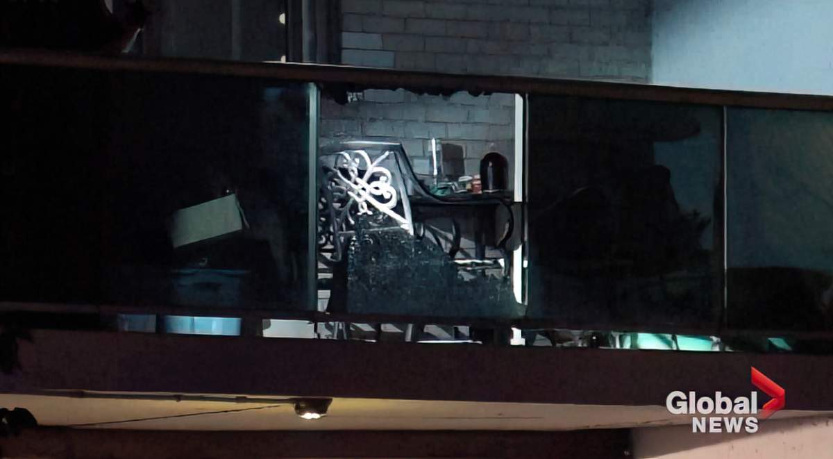 Peterborough police discover a broken glass pane at a patio at a Brock Towers apartment on July 6, 2024. A man was arrested on two counts of attempted murder.