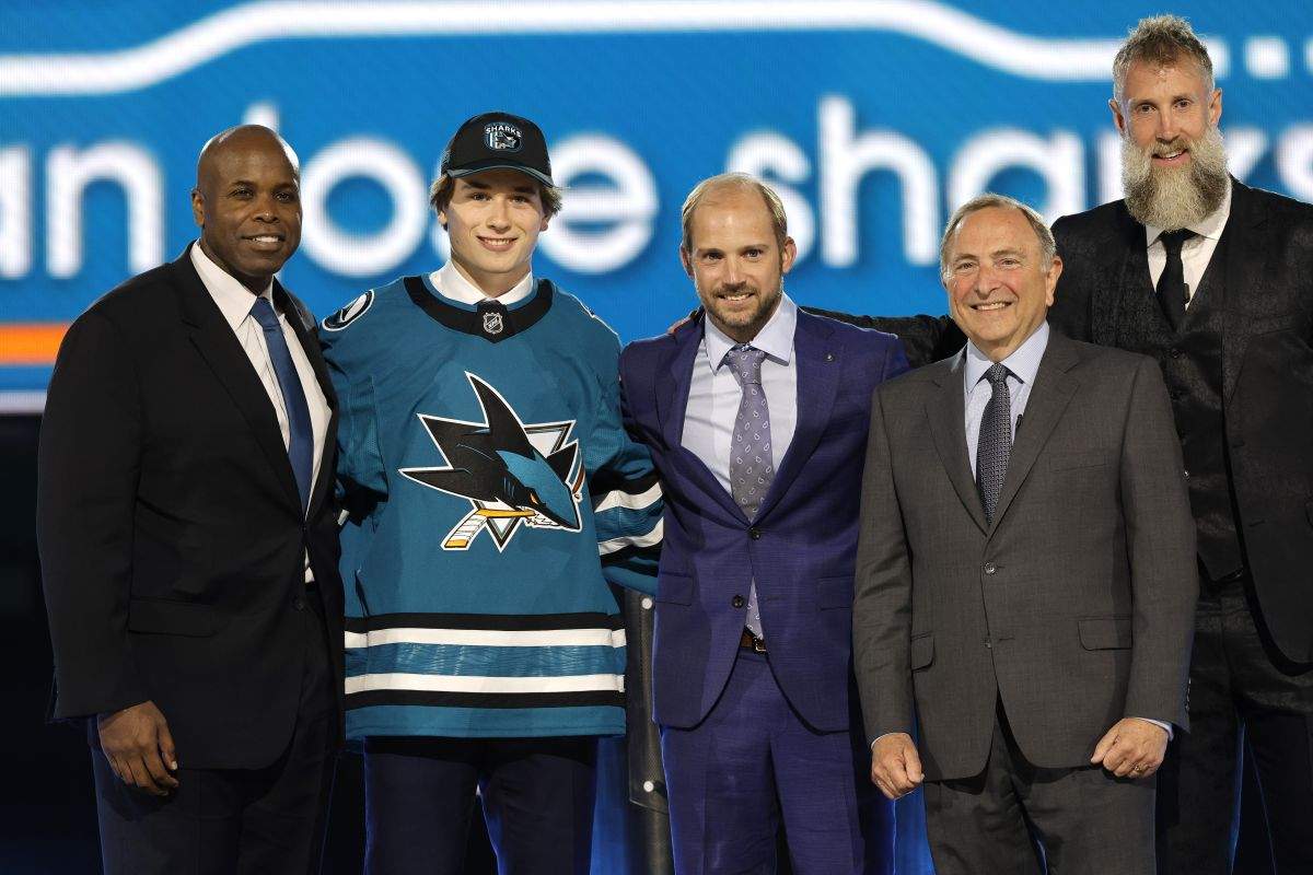 Macklin Celebrini, second from left, poses after being selected by San Jose Sharks during the first round of the NHL hockey draft Friday, June 28, 2024, in Las Vegas.