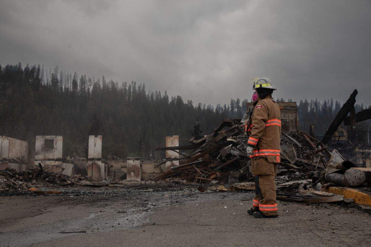 Fire crews work to put out hotspots in the Maligne Lodge in Jasper, Alta., on Friday July 26, 2024. Wildfires encroaching into the townsite of Jasper forced an evacuation of the national park and have destroyed over 300 of the town's approximately 1100 structures, mainly impacting residential areas.