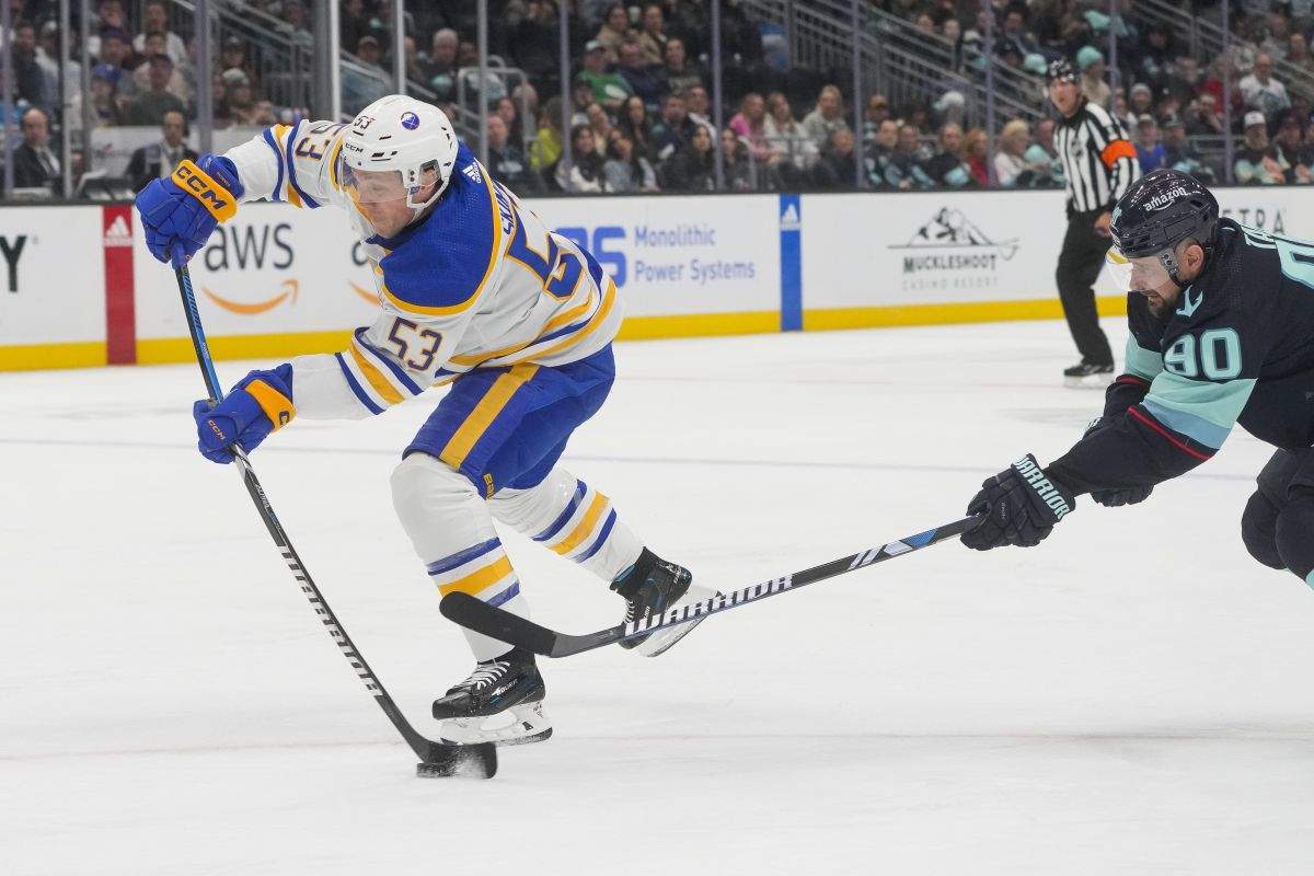 Buffalo Sabres left wing Jeff Skinner (53) shoots and scores ahead of Seattle Kraken left wing Tomas Tatar, right, during the second period of an NHL hockey game Monday, March 18, 2024, in Seattle.