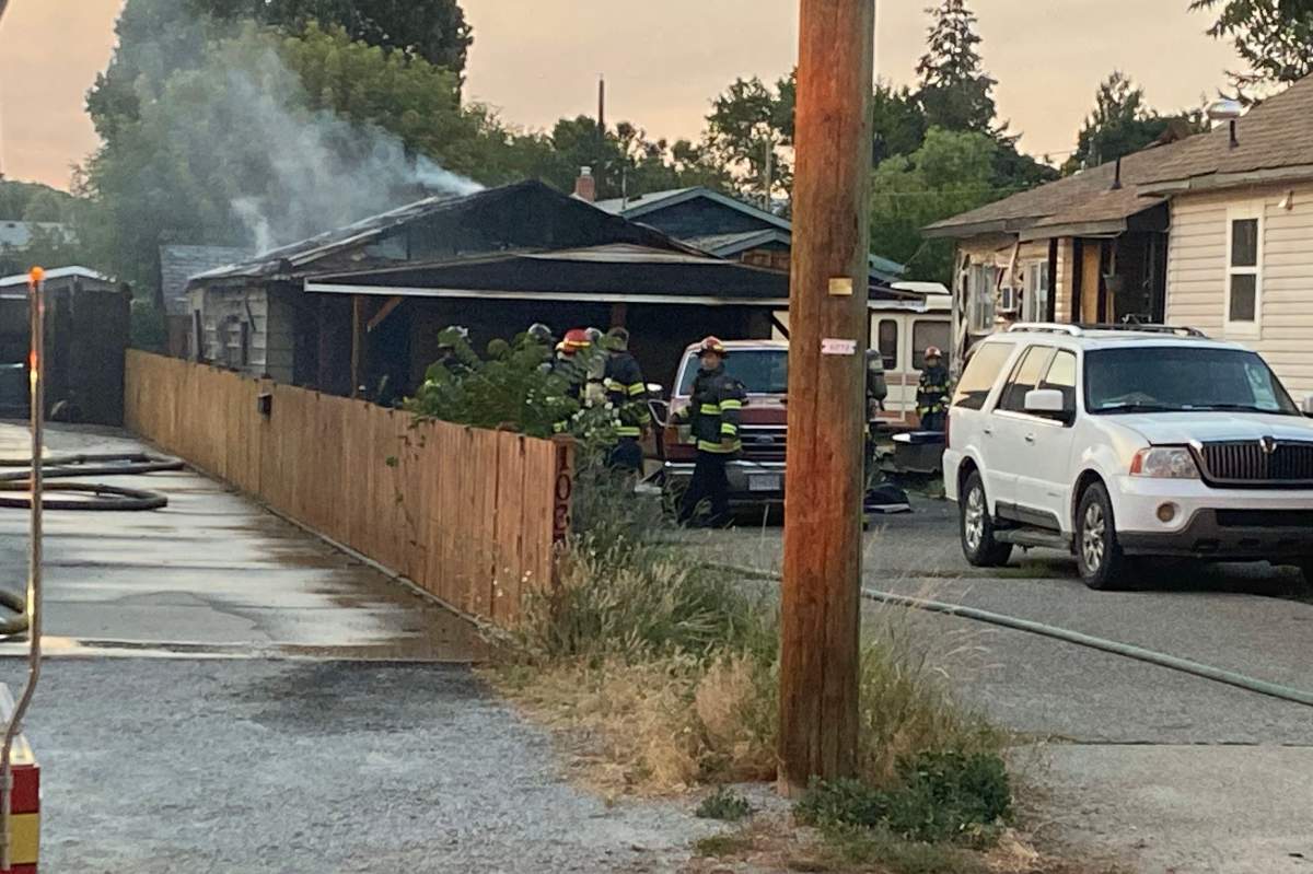 Crews at the scene of a garage fire in the Rutland neighbourhood of Kelowna on Friday evening.