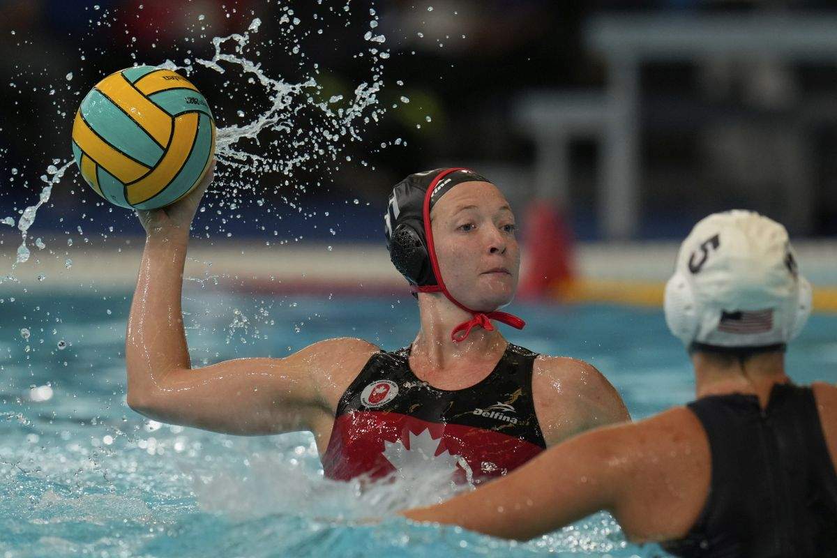 Canada's Kindred Paul takes a shot against the United States during the women's water polo gold medal match at the Pan American Games in Santiago, Chile, Saturday, Nov. 4, 2023.