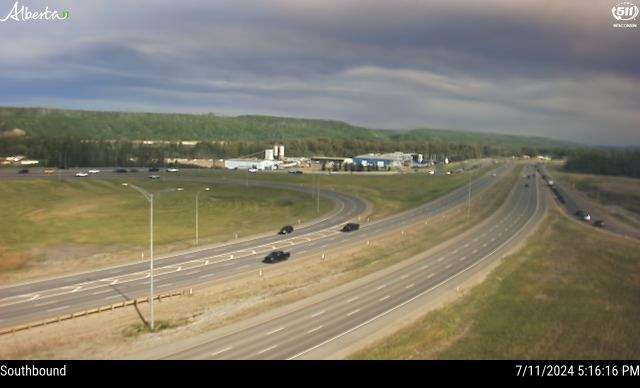 A traffic camera image from Highway 63 and Confederation Way in Fort McMurray showing wildfire smoke moving in on Thursday, July 11, 2024.