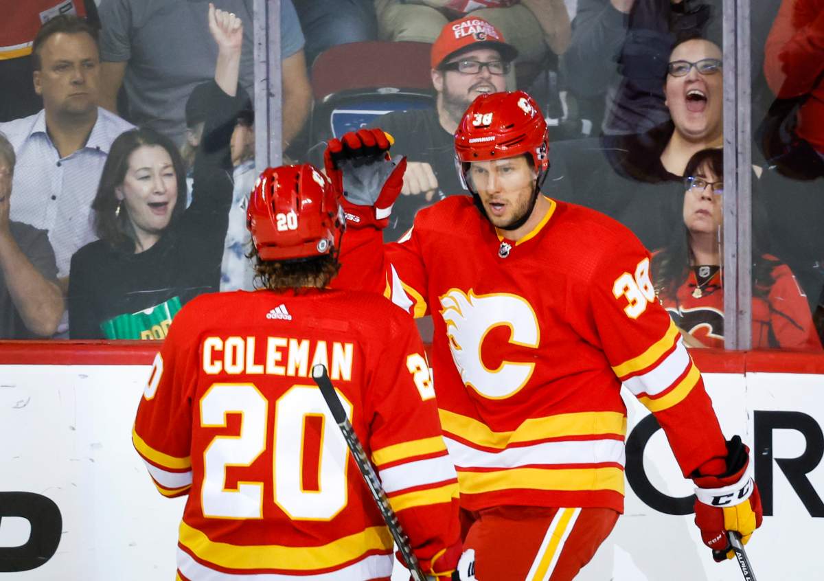 Calgary Flames centre Brett Sutter, right, celebrates his goal with teammate forward Blake Coleman during second period NHL pre-season hockey action against the Edmonton Oilers in Calgary on September 28, 2022. The son of former NHL coach Darryl Sutter played in 1,090 games in the American Hockey League and another 60 in the NHL. Sutter concluded his playing career with the Calgary Flames' AHL affiliate, the Calgary Wranglers, and will join the team's coaching staff as an assistant.