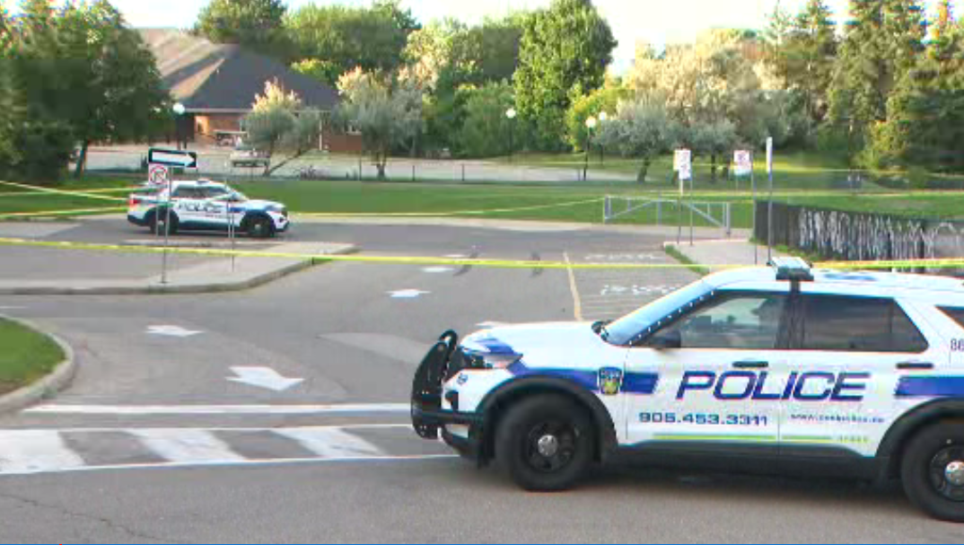 Police at the scene of a fatal stabbing in the area of Glen Erin Drive and Britannia Road West in Mississauga on Saturday.