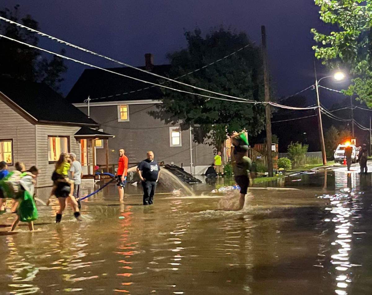 The mother of three had kids on her back during the flood