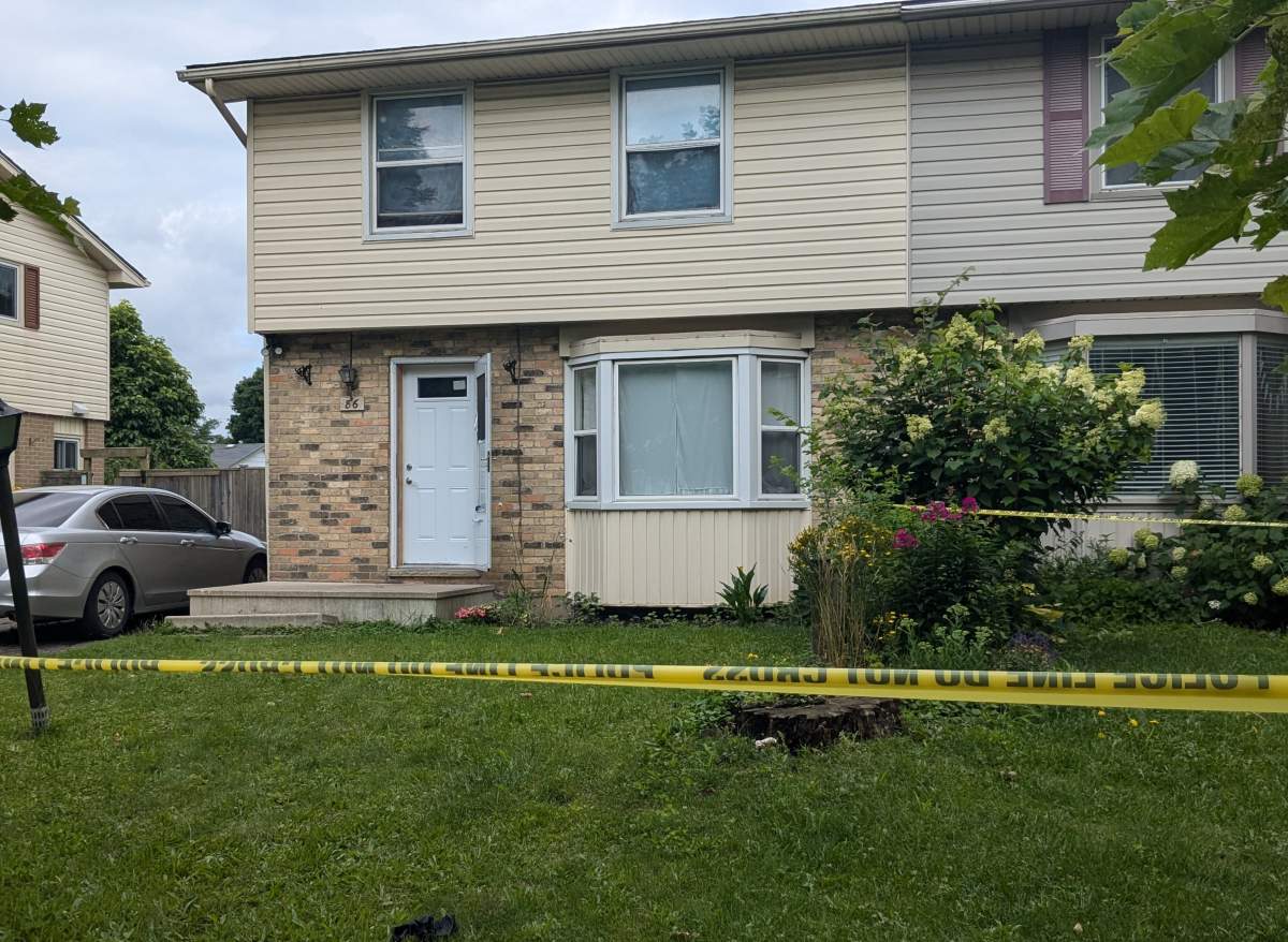 A police caution tape set up outside a home.