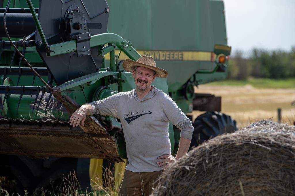 Farmer Will Robbins stands for a photograph at his farm near Laura, Sask., Wednesday, Aug. 21, 2024. Robbins, a younger producer who's taking over the family farm, says the prices of farmland are so high that he doesn't consider expanding the farm. THE CANADIAN PRESS/Liam Richards.