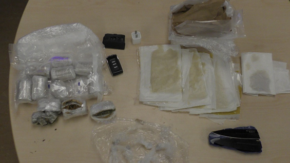 A Kingston correctional officer and an inmate face charges, accused of smuggling drugs, weapons and contraband into Collins Bay Institution.