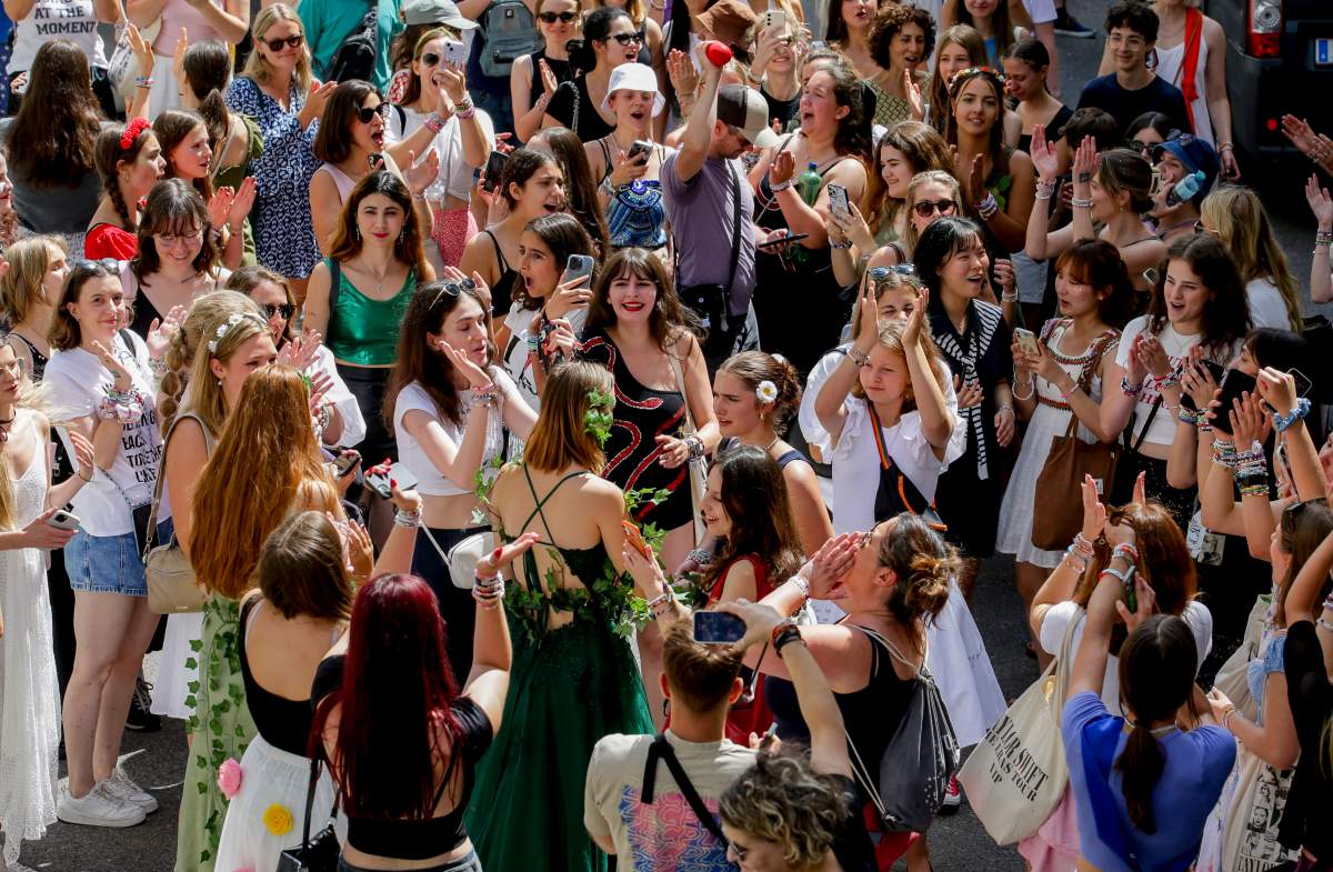 Swifties sing and dance in Vienna on Friday, Aug. 9, 2024.