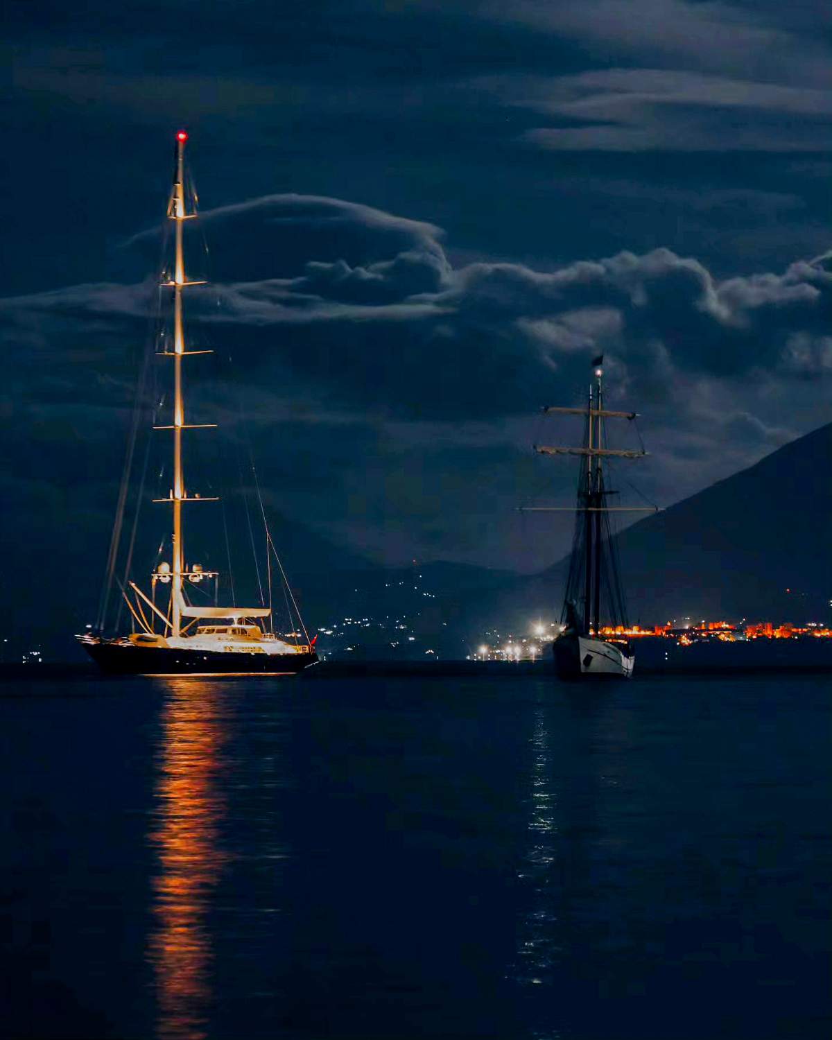 This picture ,on Sunday, Aug. 18, 2024, shows the UK's vessel Bayesian, left, and the Duch sailboat Sir Robert Baden Powell at anchor off the Sicilian village of Porticello near Palermo, in southern Italy, The Bayesian sunk when a violent sudden storm hit the area.