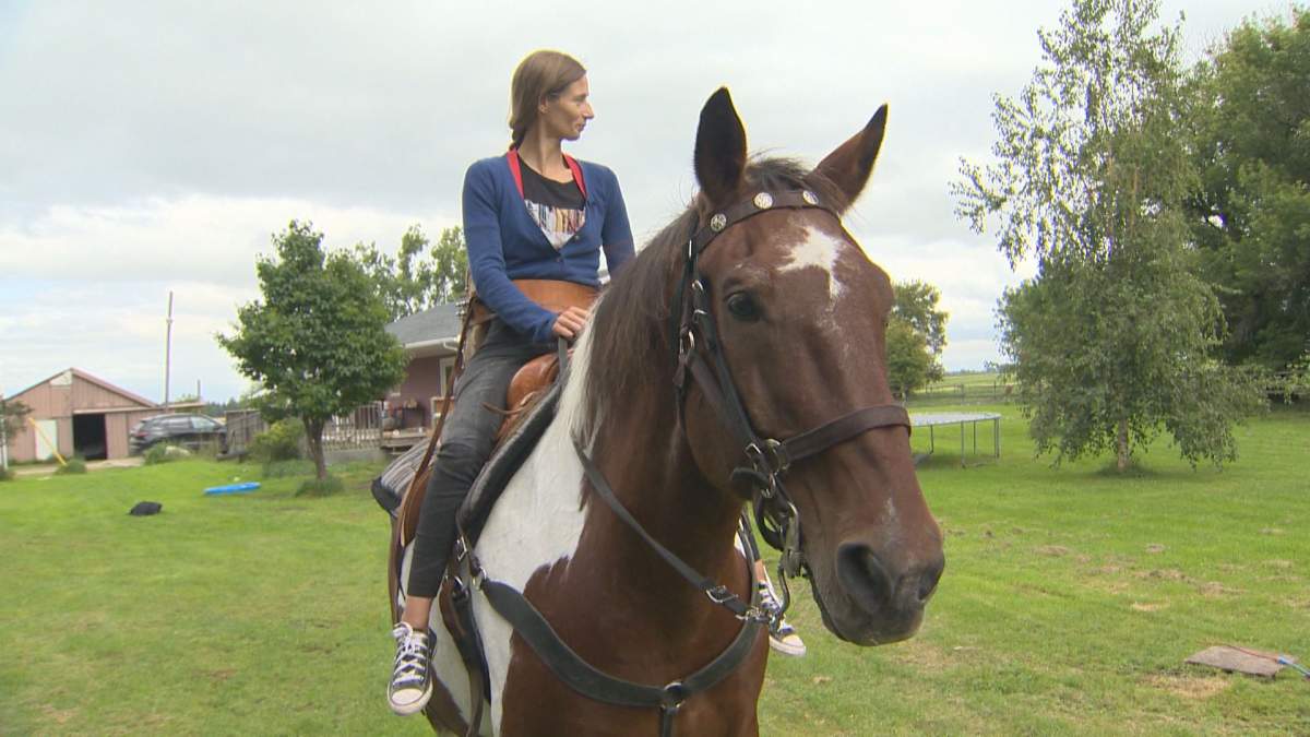 Manitoba jockey paralyzed in accident back in the saddle - image