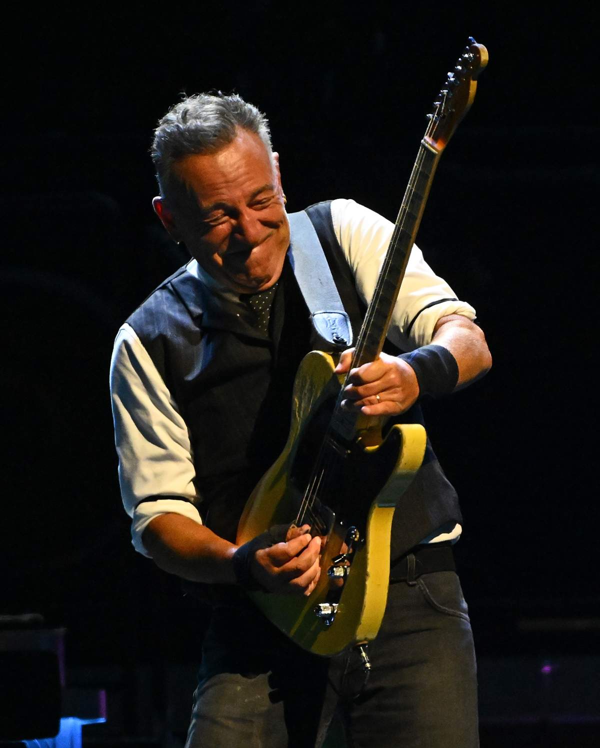 Bruce Springsteen playing the guitar.