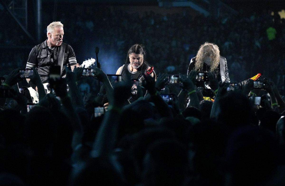 James Hetfield, from left, Robert Trujillo, and Kirk Hammett of Metallica perform at Soldier Field on Friday, Aug. 9, 2024, in Chicago, Ill.