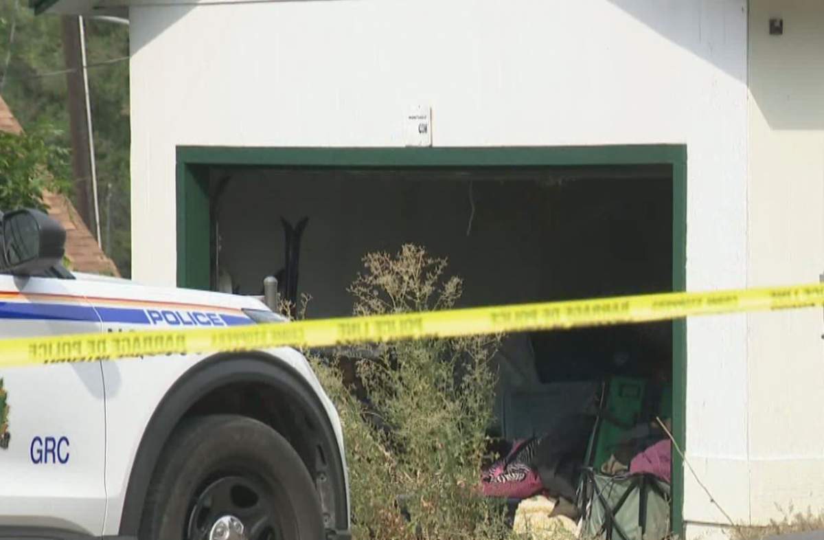 Police tape surrounds a home along the 2100 block of 32nd Street in Vernon, B.C, where RCMP discovered a body early Thursday.