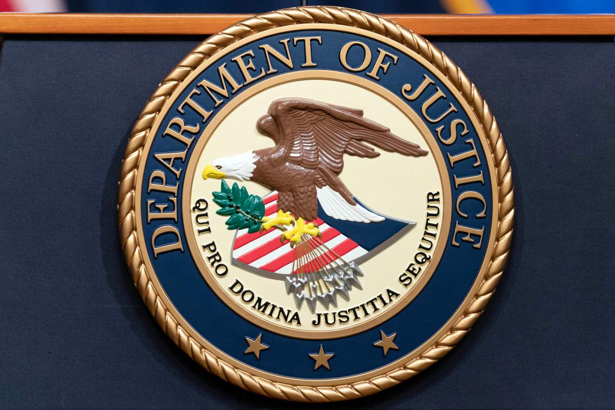 FILE - The Department of Justice seal is seen during a news conference at the DOJ office in Washington, May 16, 2023.